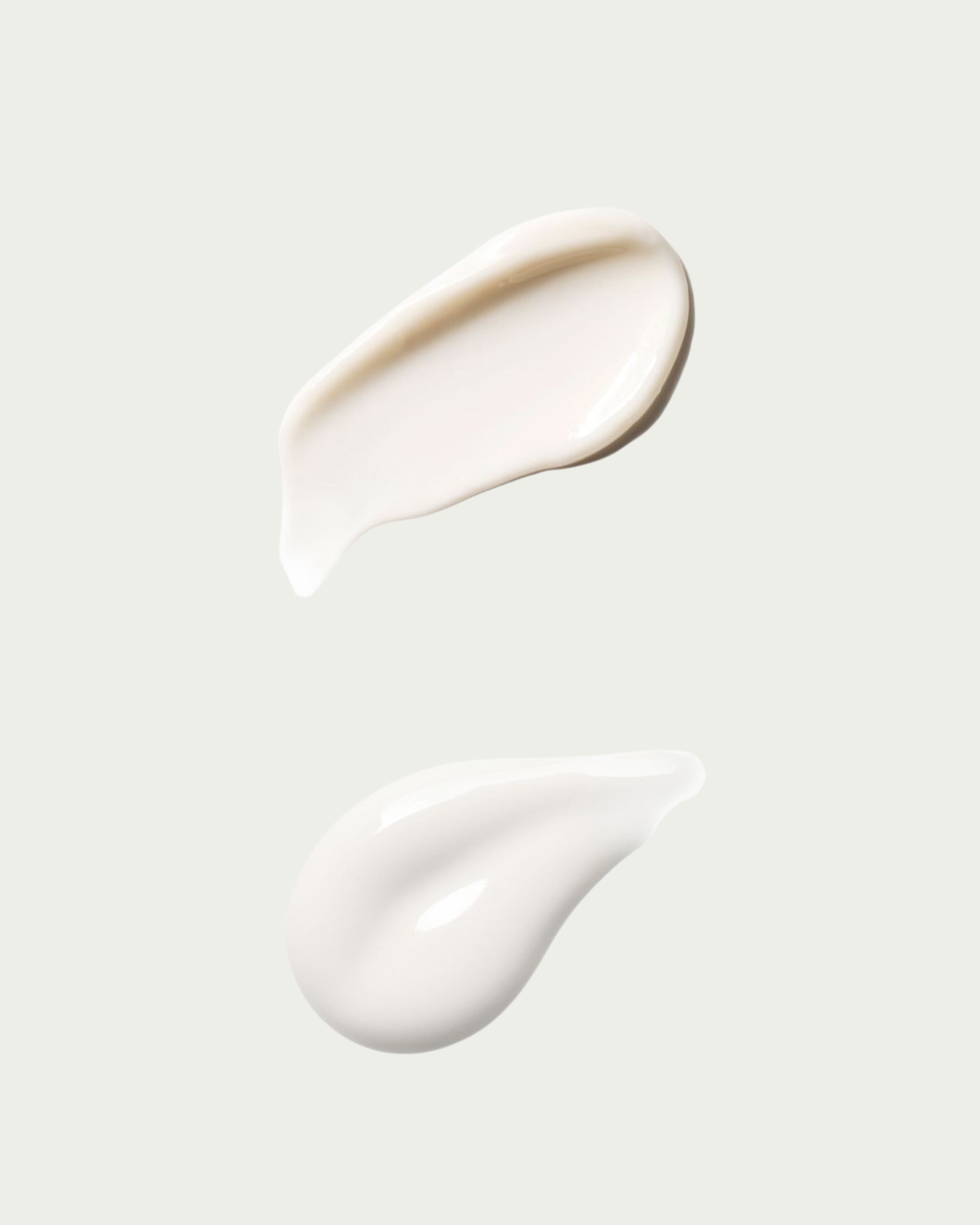 Two texture swatches of white cream on a light gray background